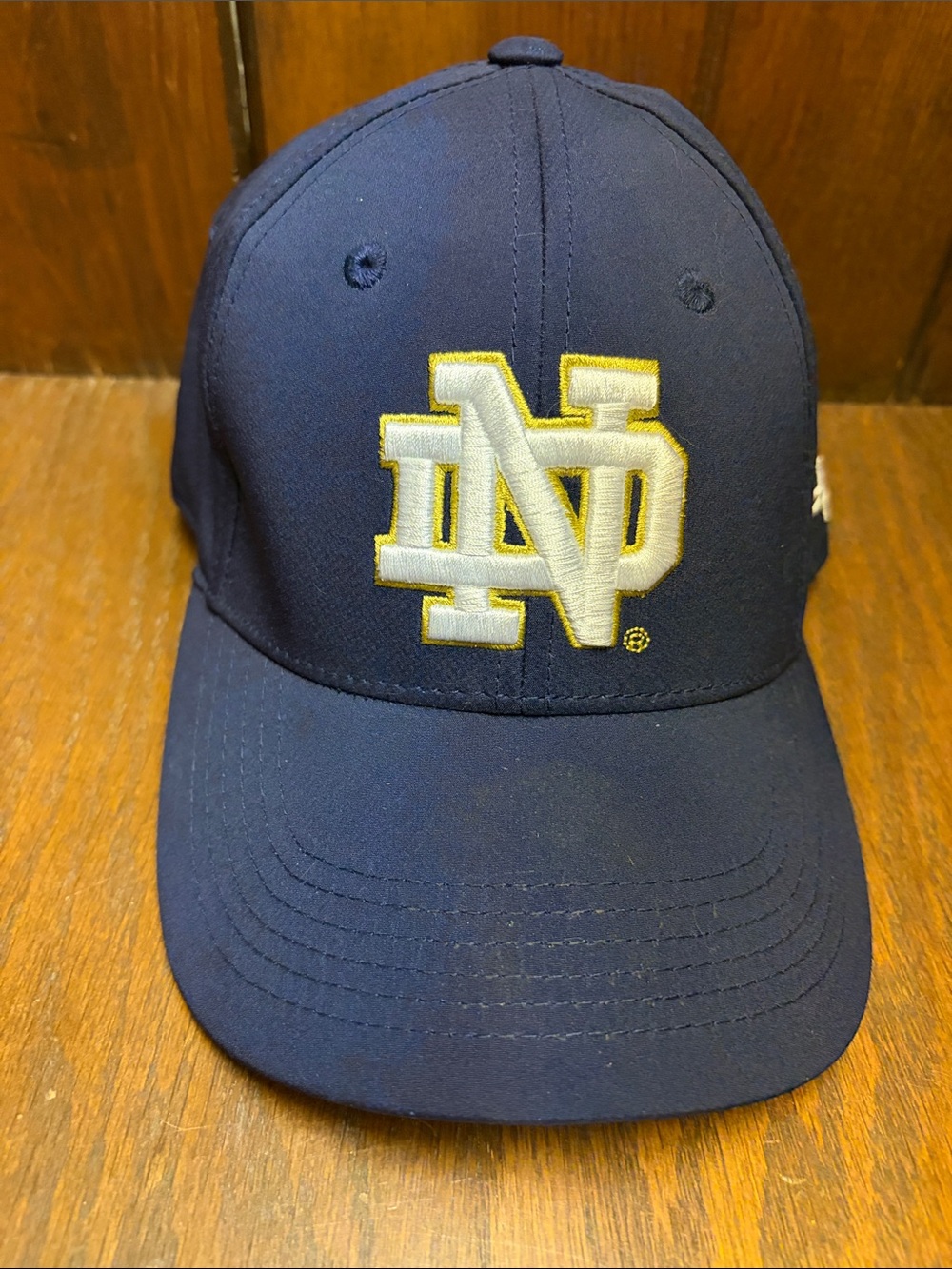 Under Armour Navy Hat with White & Gold Embroidered Logo